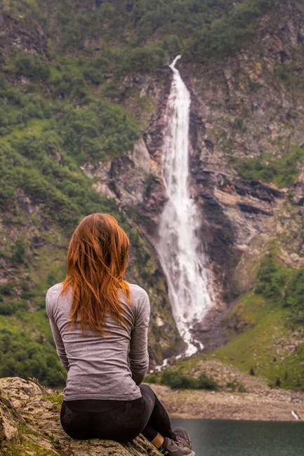 Woman viewing waterfall