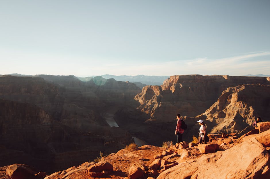 Hikers in a canyon at sunset